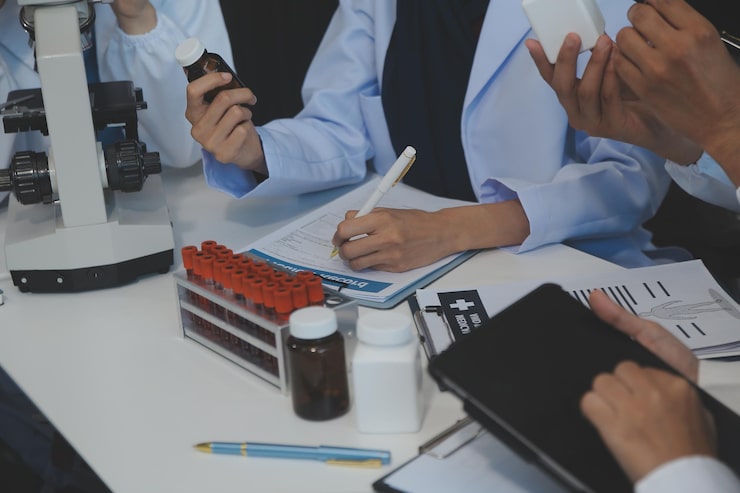 team-medical-staff-having-morning-meeting-boardroom-doctors-nurses-looking-digital-tablet_265022-91204